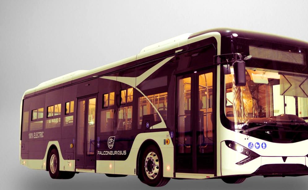 Maroon and cream electric city bus photographed from the front three-quarter angle in a studio